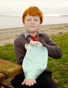Nine-year-old Oisin Millea of Passage East, Ireland, found the message-in-a-bottle tossed into the Gulf of St. Lawrence in 2004. 