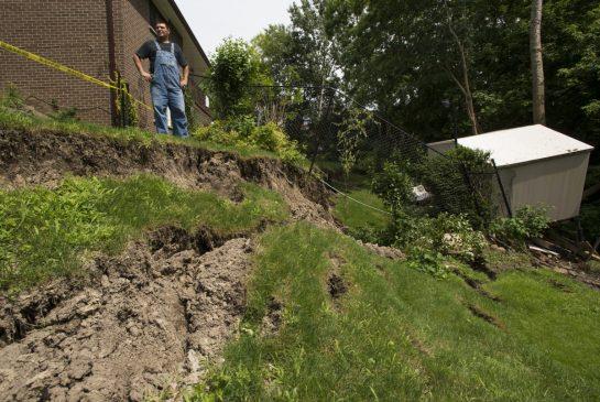 Vito Ginevra surveys his neighbour's crumbling backyard after the July 8 storm that sent his own shed sliding several feet below the place it was erected. Property that backs onto ravines and creeks in several parts of the GTA has undergone serious erosion, raising questions about who should pay to fix properties built on before modern restrictions.</p></p></p> <p><p><p>