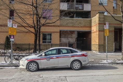 On the same day that new parking rules came into effect, a parking enforcement car parked illegally as the officers took a lunch break at Dundas and Mutual, Jan. 23, 2014. CITYNEWS